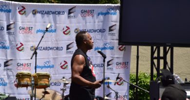 Ray Parker Jr. in sleeveless no ghost shirt setting up at Ghostbusters Fan Festvial in 2019